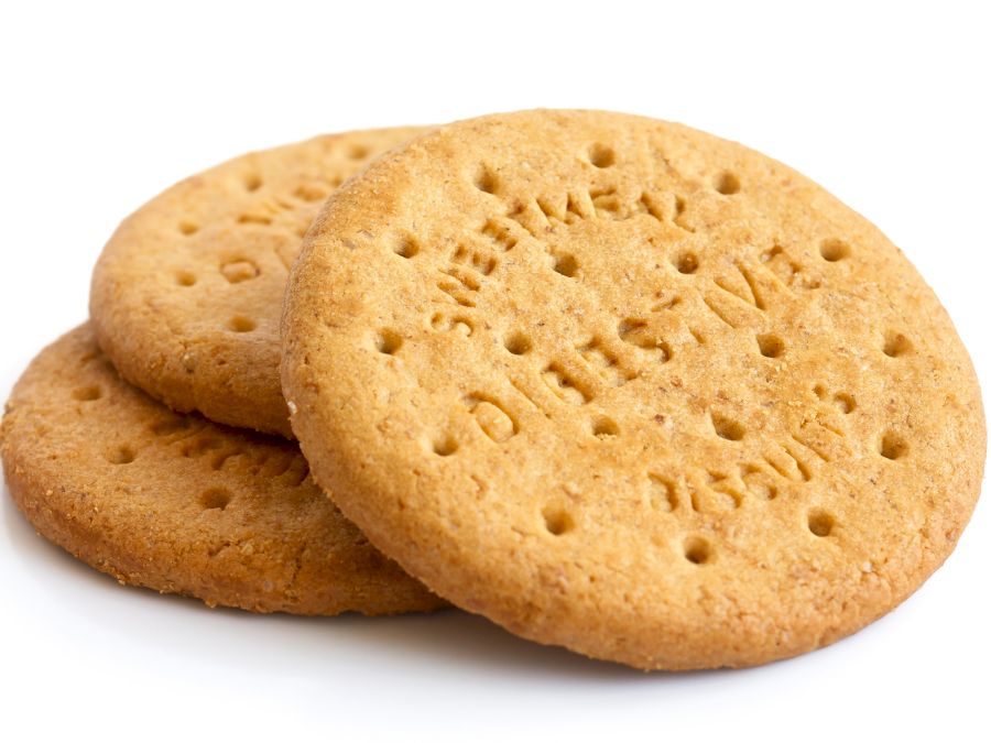 Stack of sweetmeal digestive biscuits isolated on white.