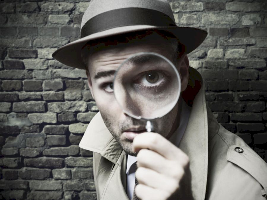 detective-with-magnifying-glass-100735058-large