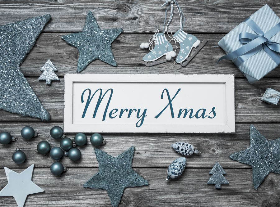 Merry Xmas greeting card with white wooden sign and blue turquoi
