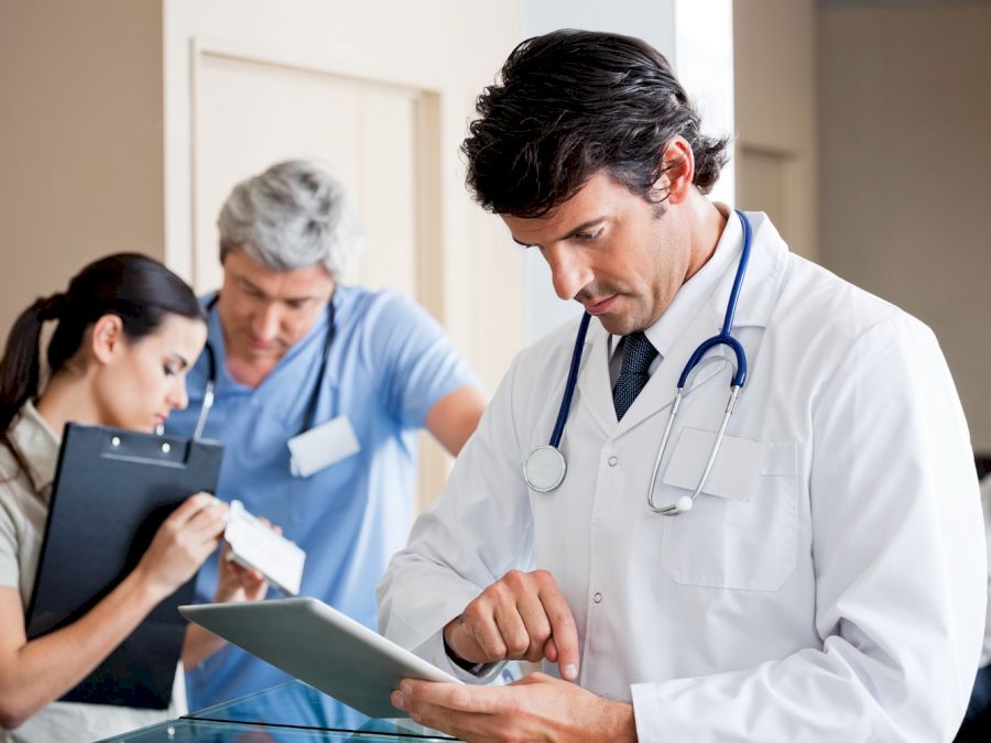 Male Doctor Using Digital Tablet