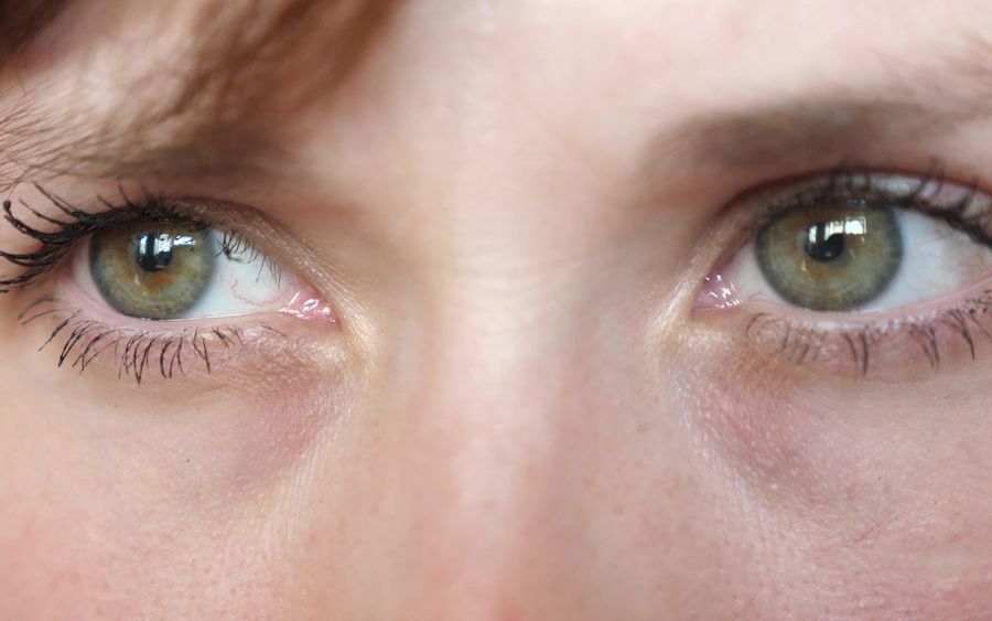 portrait of beautiful gray-green eyes of a young beautiful woman. beautiful eyes girls closeup.