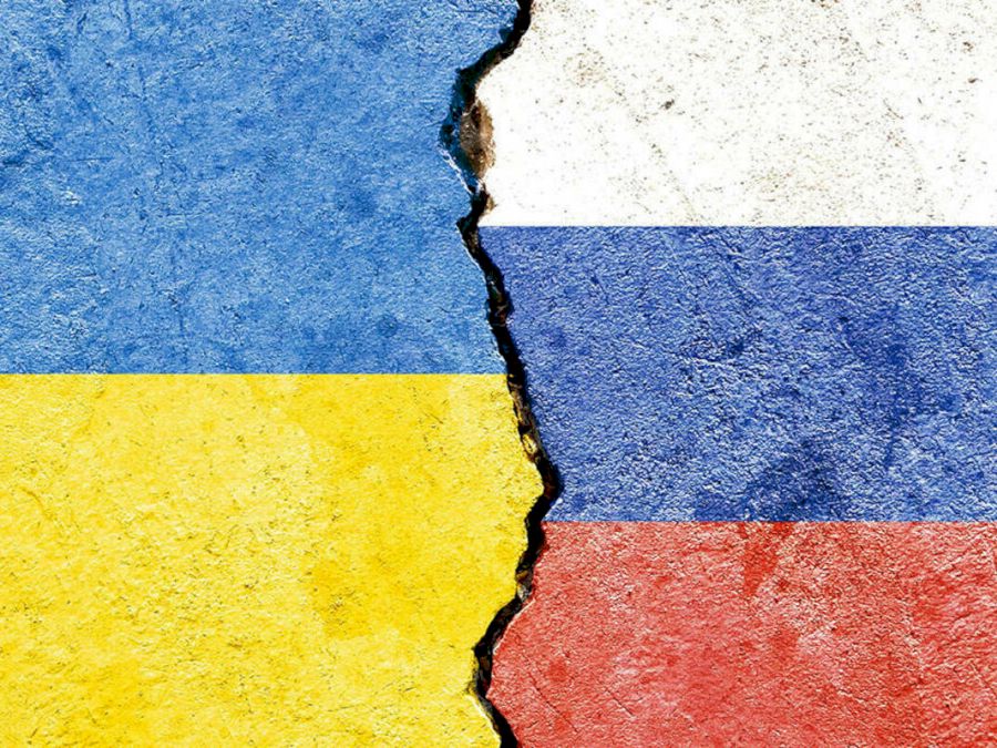 Faded Ukraine VS Russia national flags icon isolated on broken weathered cracked concrete wall background