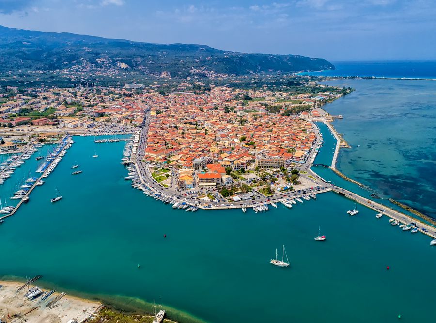 Sailboats in the marina and the city of Lefkada island, Greece