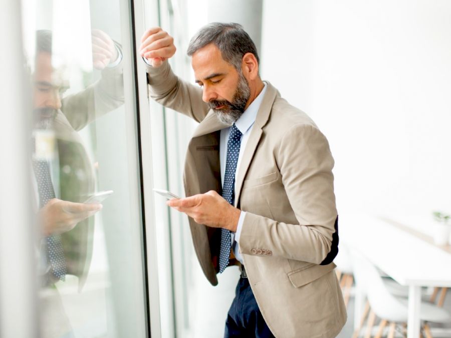 Handsome mature businessman  with mobile phone
