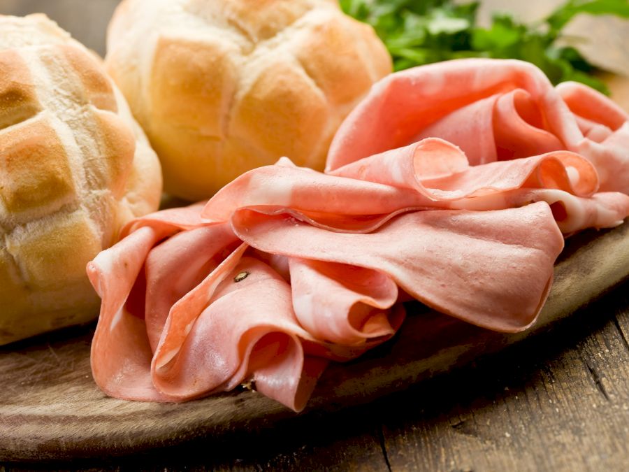 Mortadella with Bread on Chopping board